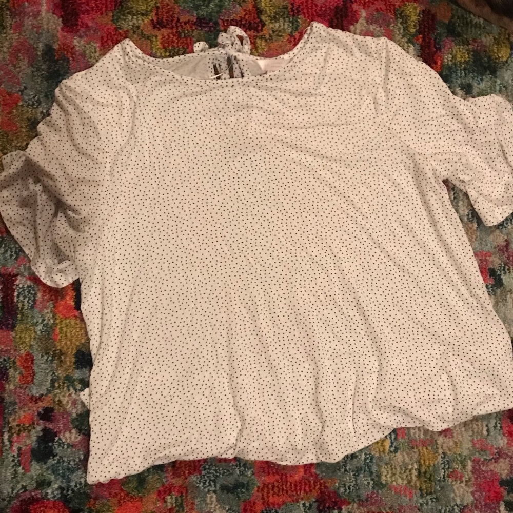 White shirt with black poke-a-dots
